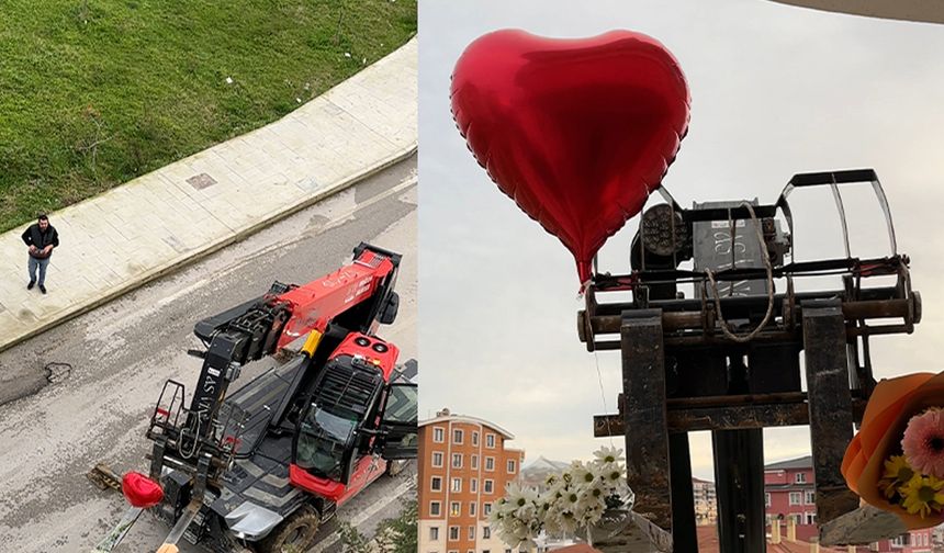 Sevgililer Günü’nü unuttu, iş makinesiyle balkona çıkarttığı güllerle gönül aldı