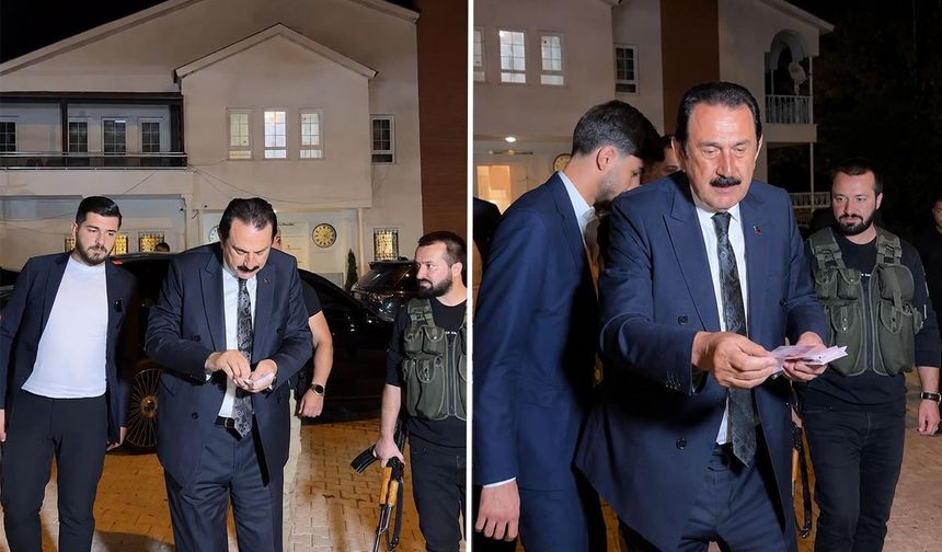 Aşiret lideri aracından iner inmez deste deste para dağıttı